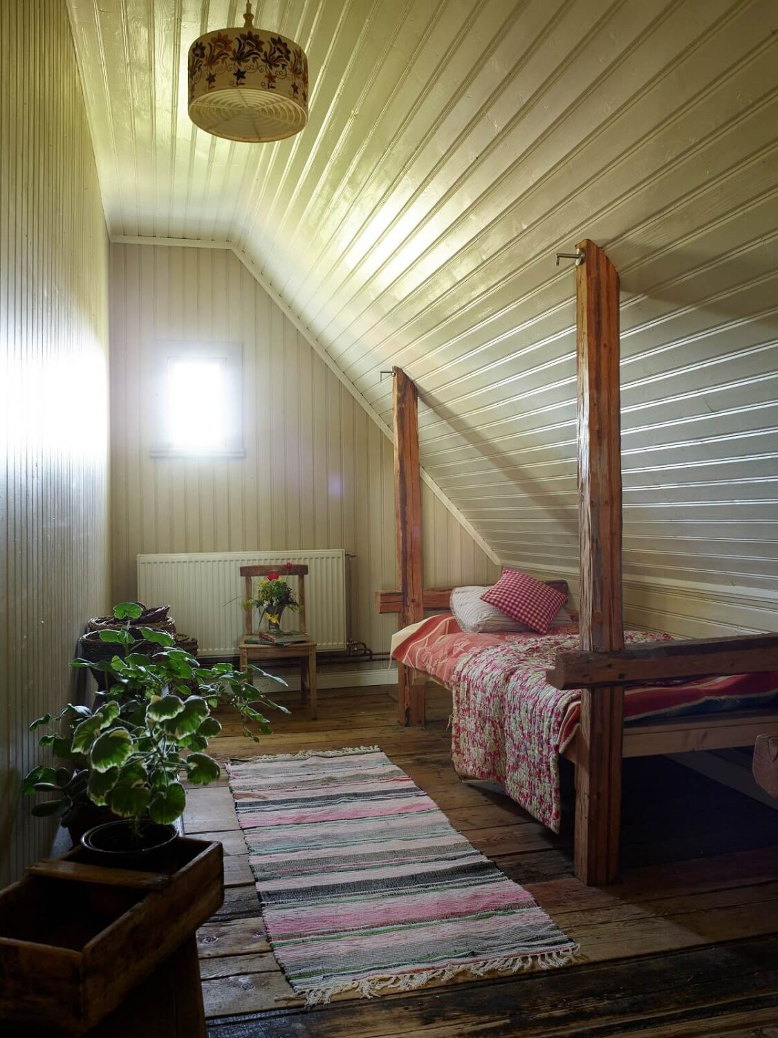 A Vintage Colorful Family Home in the Swedish Countryside 23 small-attic-bedroom-wooden-beams-nordrom