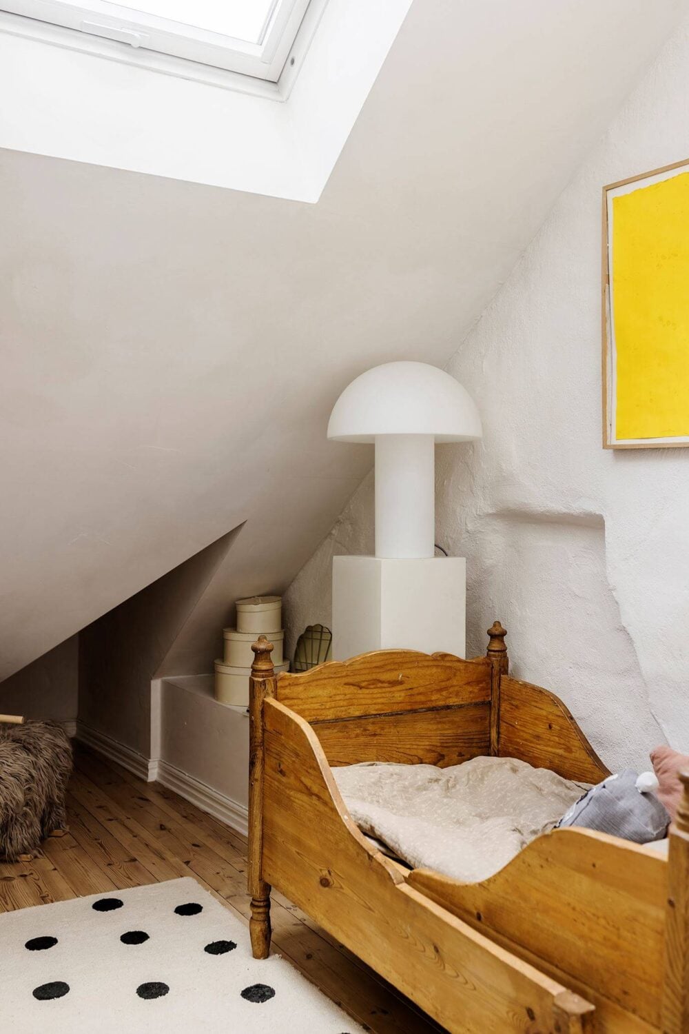 A Charming Attic Apartment with High Ceilings 18 small-kids-bedroom-woodened-skylight-slanted-ceiling-nordroom