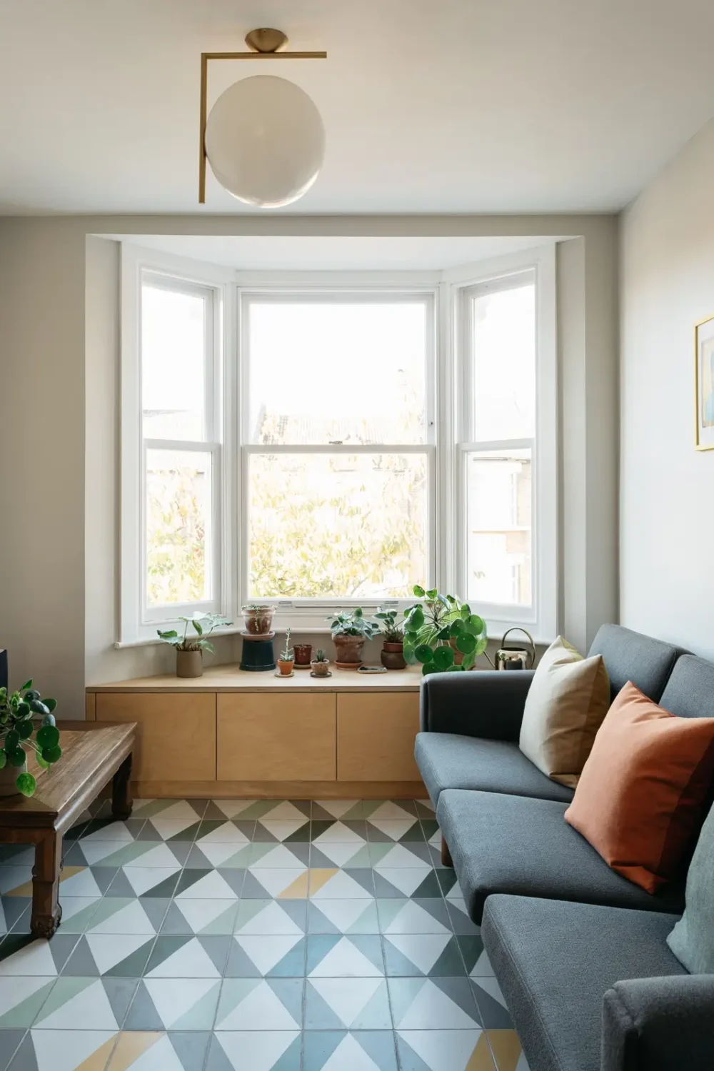 Modern Custom Interiors in a Victorian Home 8 small-minimalistic-living-room-geometric-floor-tiles-bay-window-storage-nordroom
