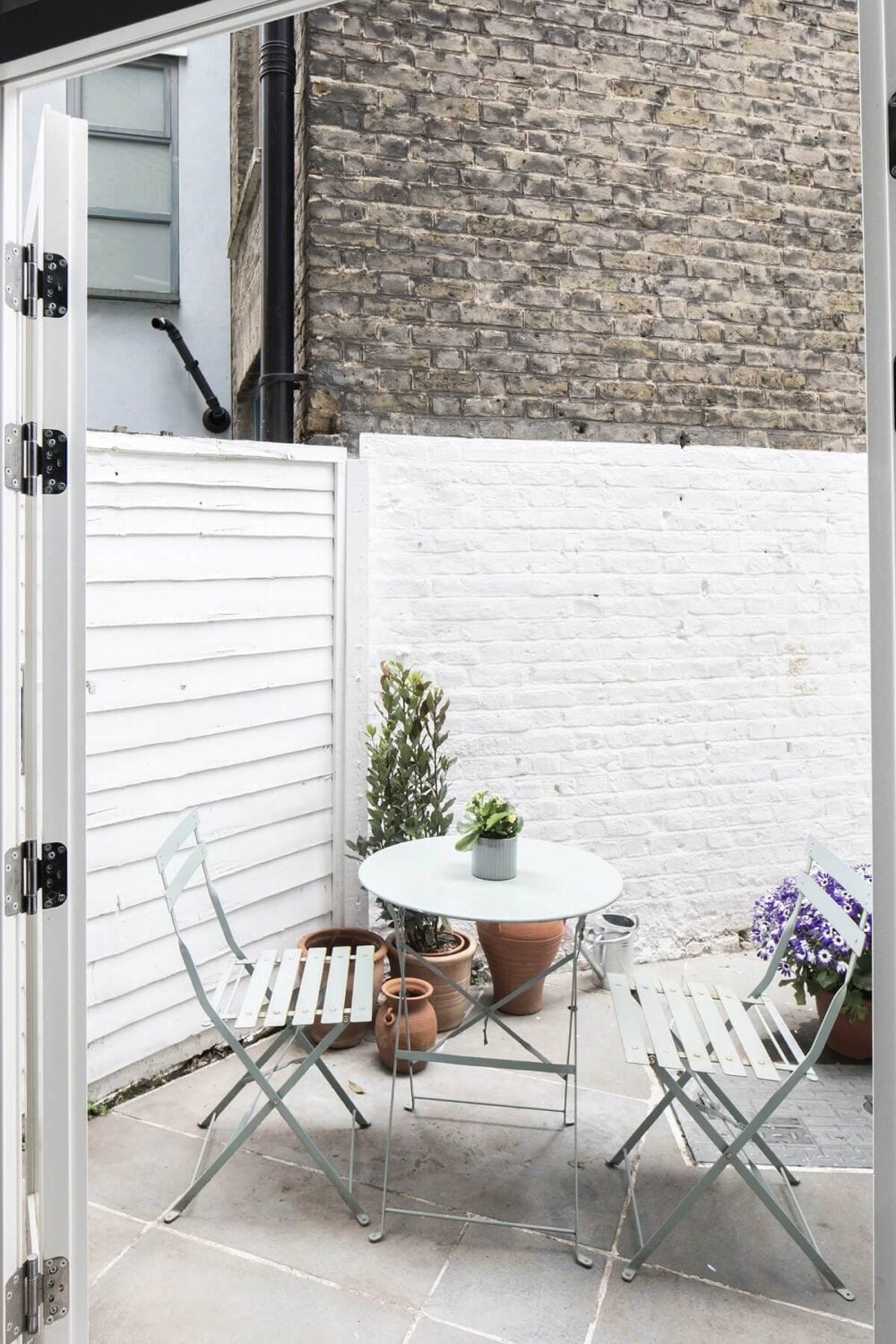Muted Natural Colors in a Victorian House 8 small-patio-bistro-table-nordroom