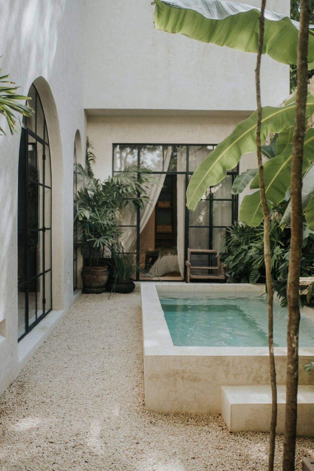 Rustic Wooden Elements in a Stylish Tulum Airbnb 30 small-swimming-pool-patio-garden-steel-framed-glass-doors-nordroom