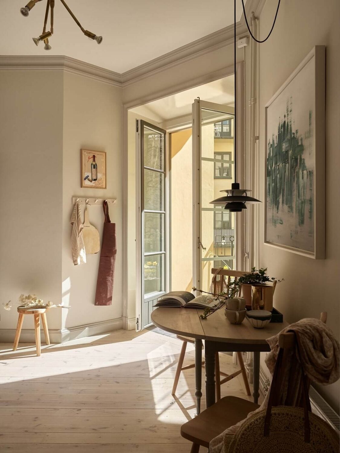 Warm Muted Colors in a Stockholm Apartment 7 small-wall-table-kitchen-balcony-beige-apartment-nordroom