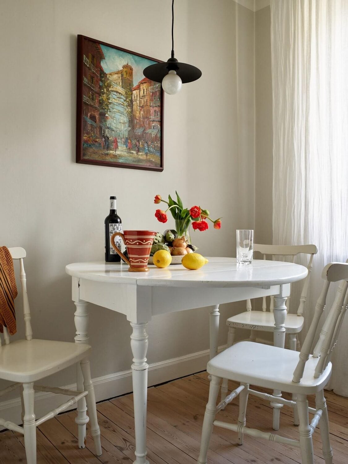 A Scandinavian Apartment with a Light Green Bedroom 11 small-white-kitchen-table-wooden-floor-nordroom