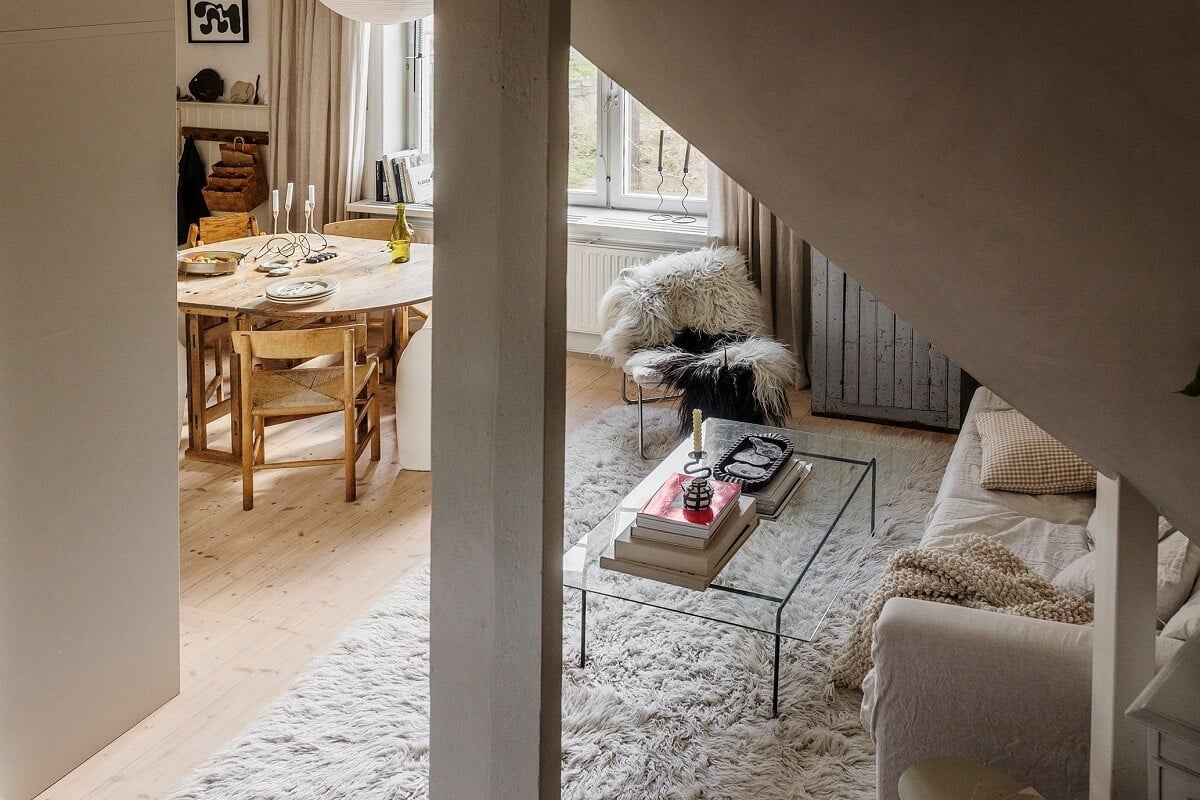 A Charming Attic Apartment with High Ceilings 9 social-living-space-open-kitchen-large-rug-nordroom