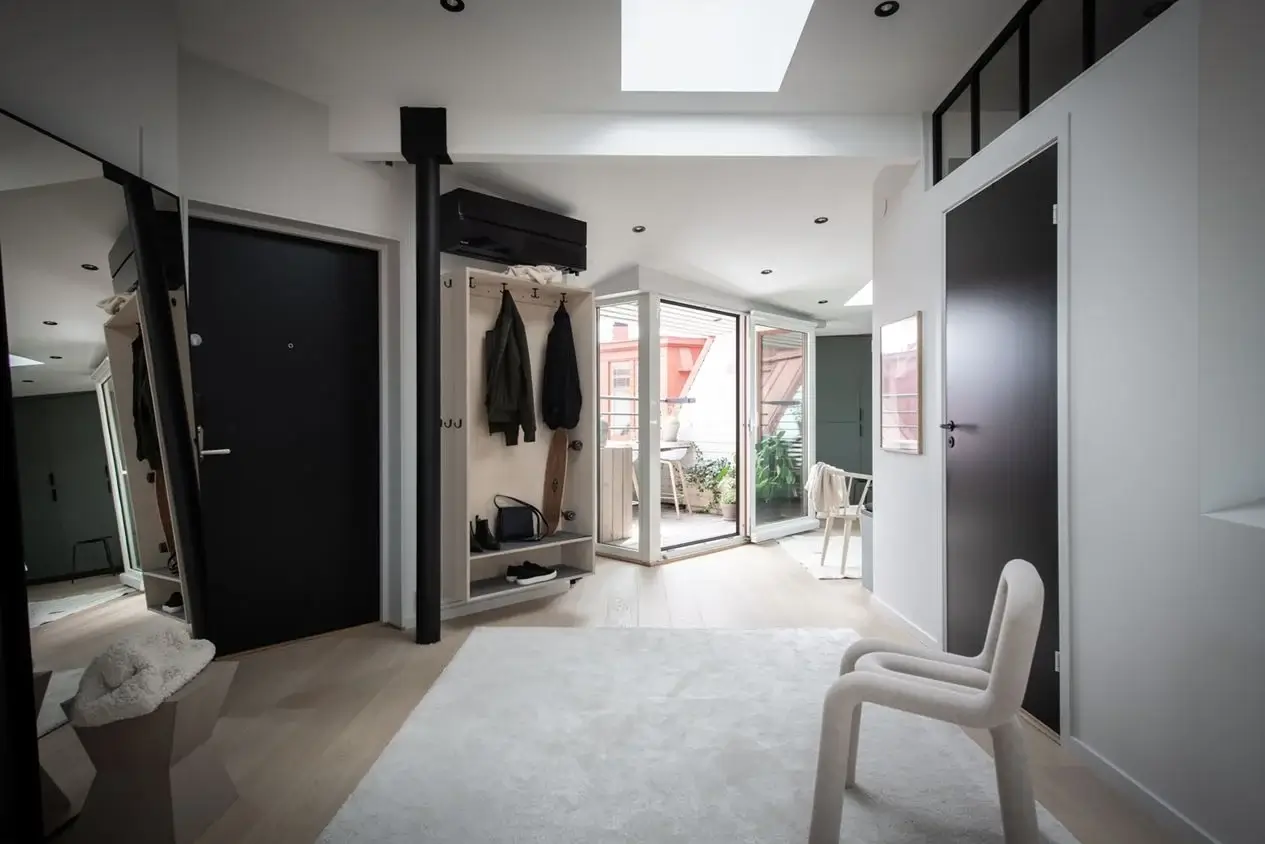 A Stylish Scandinavian Attic Apartment 16 spacious-hallway-large-mirror-attic-apartment-sweden-nordroom