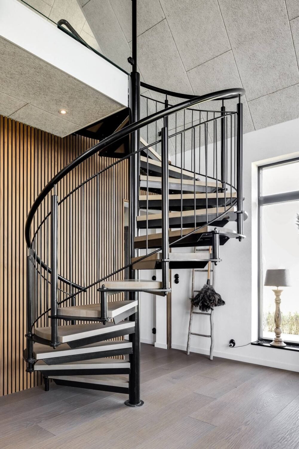 A Monochrome Swedish Villa with High Ceilings 18 spiral-staircase-wooden-accent-wall-nordroom
