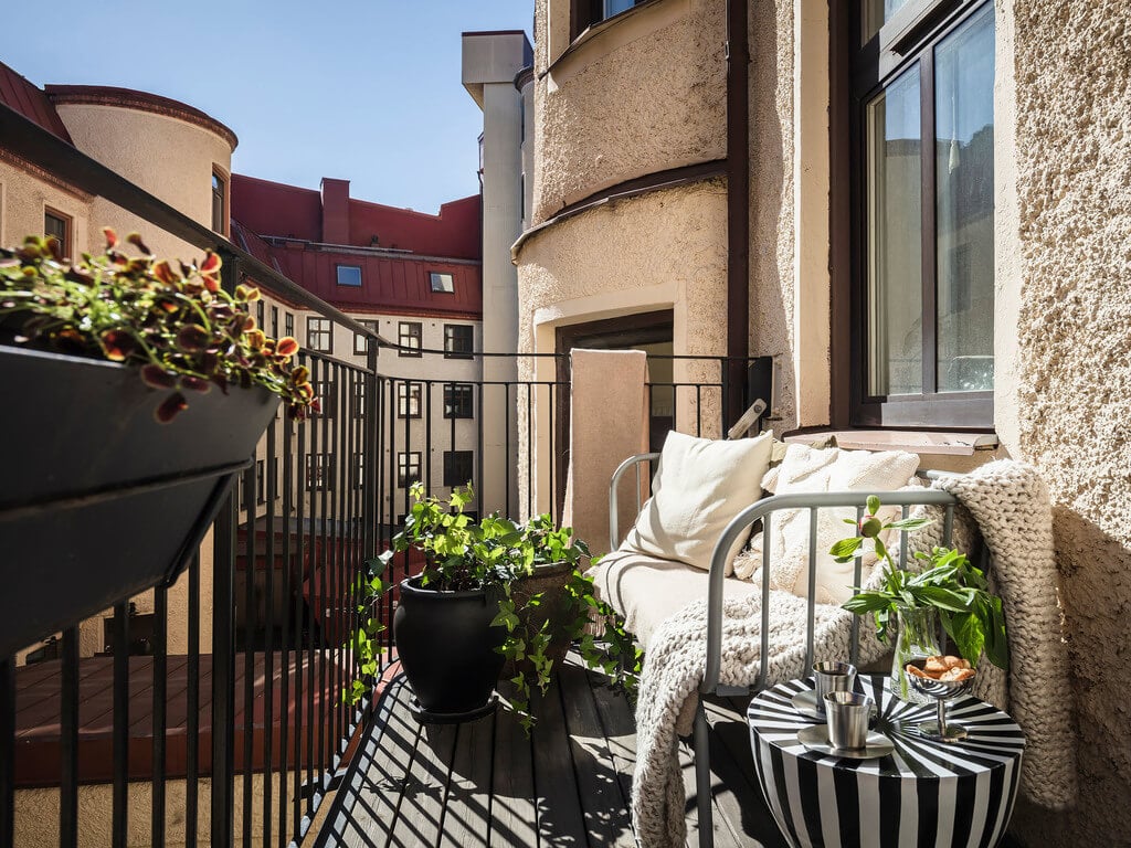 A Scandi Home with Stainless Steel Kitchen and Wallpaper 30 sunny-balcony-swedish-home-nordroom