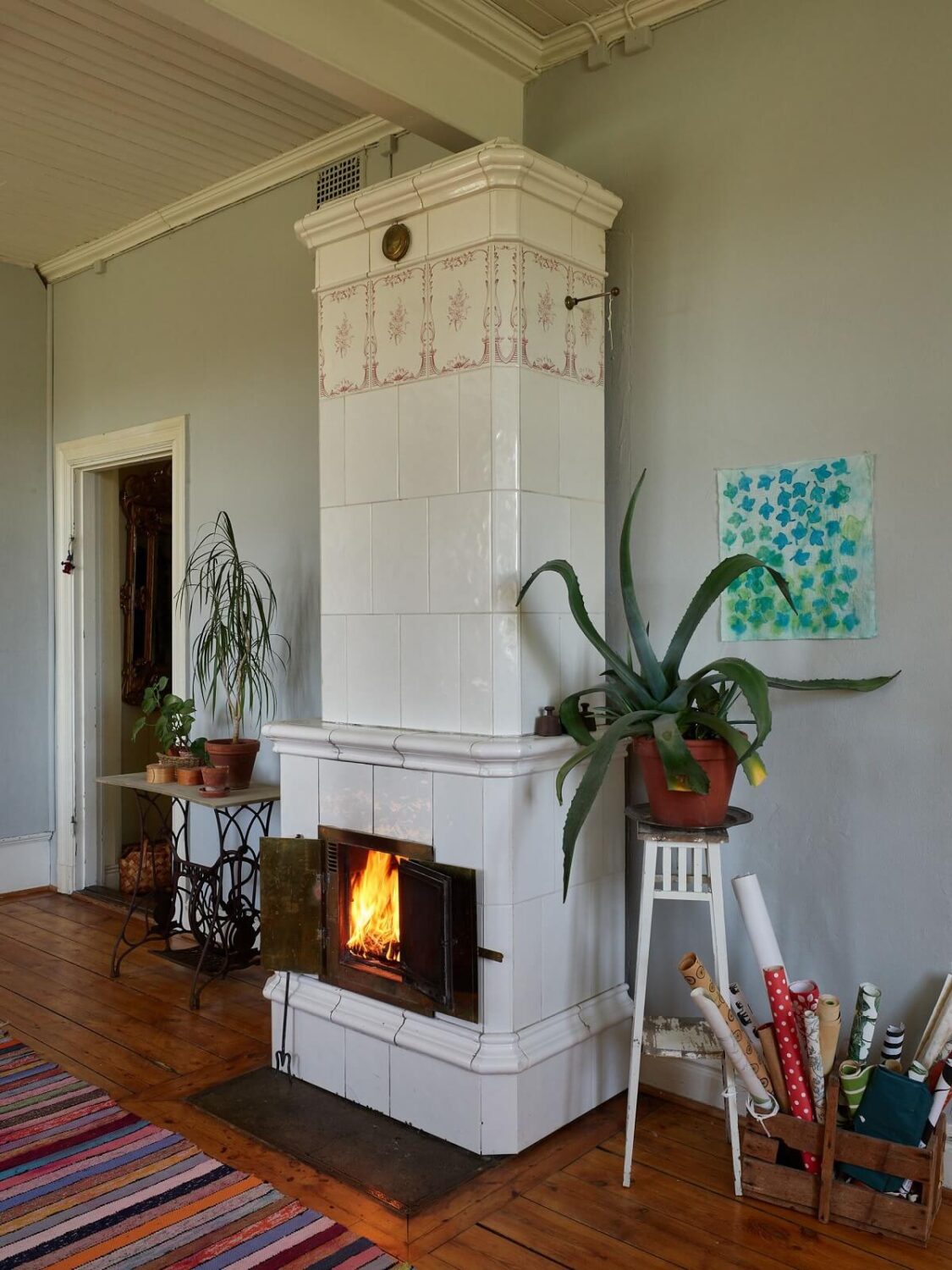A Vintage Colorful Family Home in the Swedish Countryside 8 swedish-tiled-fireplace-nordroom