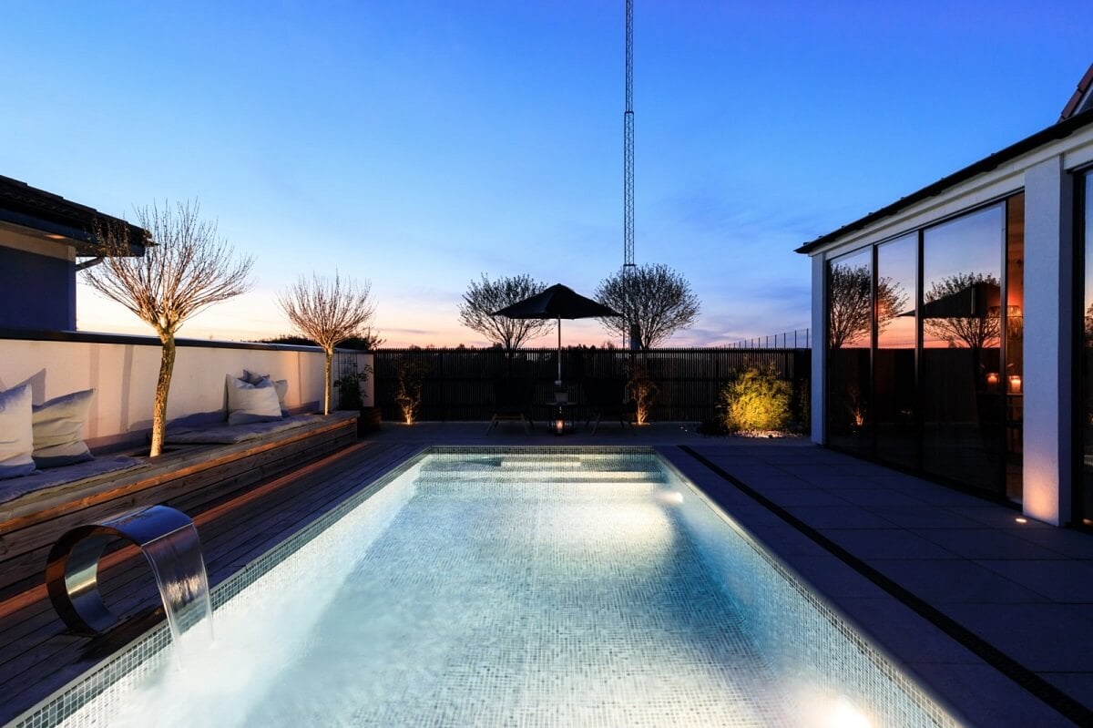 A Monochrome Swedish Villa with High Ceilings 31 swedish-villa-swimming-pool-at-night-nordroom