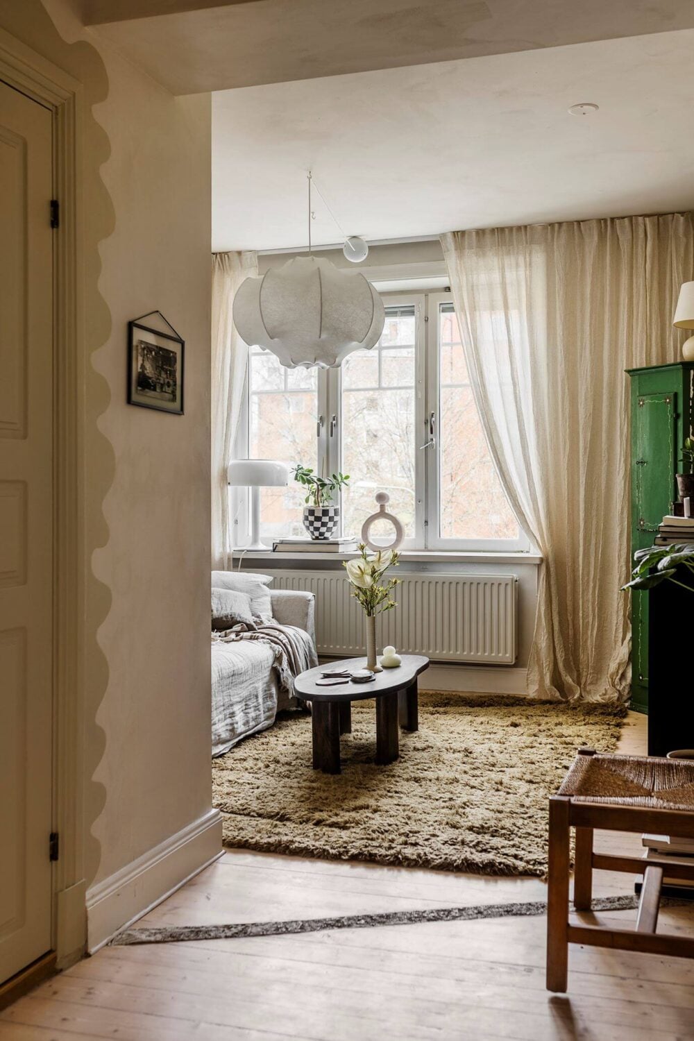 A Charming Attic Apartment with High Ceilings 11 tv-room-large-rug-attic-apartment-nordroom