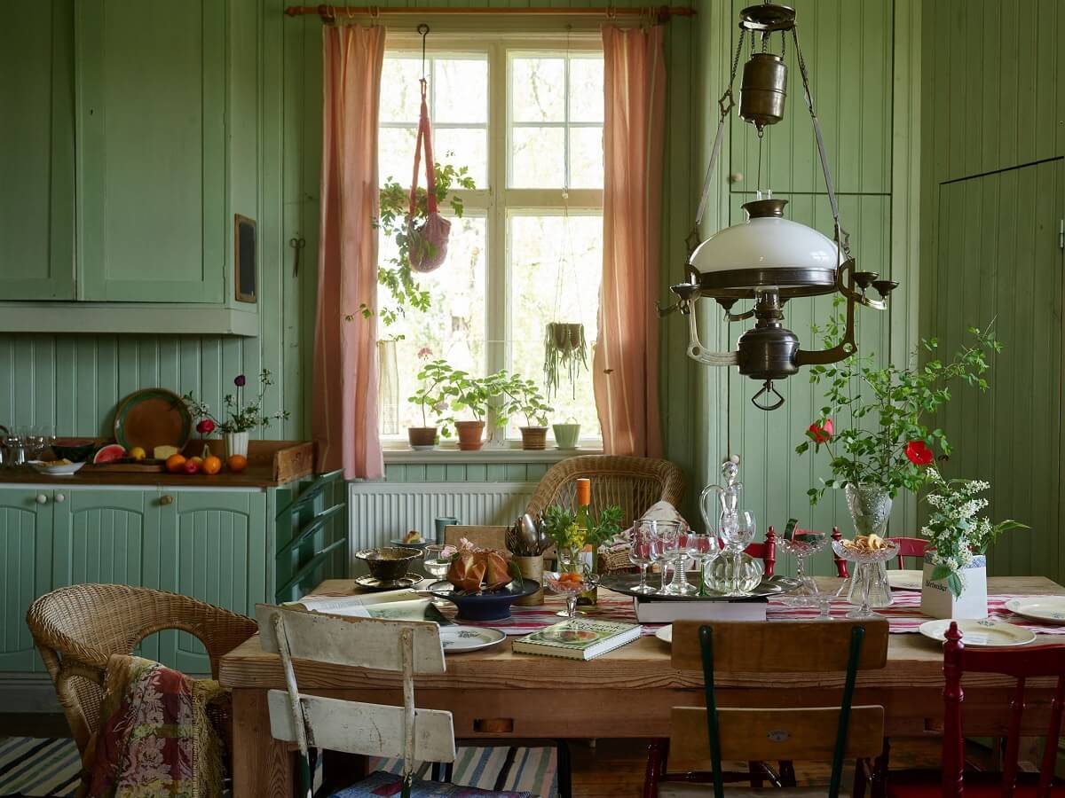 A Vintage Colorful Family Home in the Swedish Countryside 11 vintage-kitchen-dining-table-green-walls-nordroom