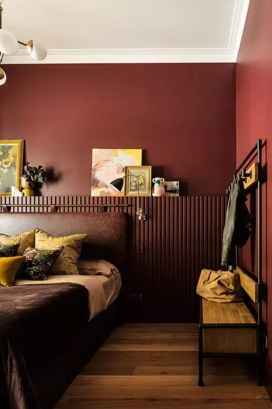 The Best Warm Paint Colors for a Bedroom 6 warm-bedroom-burgundy-paint-color-ledge-leather-headboard-nordroom