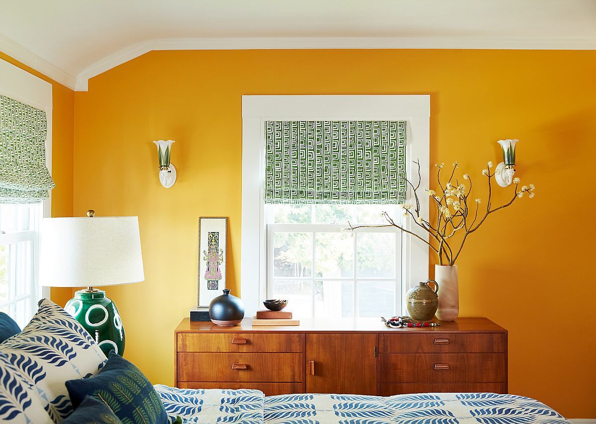 The Best Warm Paint Colors for a Bedroom 29 warm-sunny-yellow-walls-bedroom-midcentury-dresser-nordroom