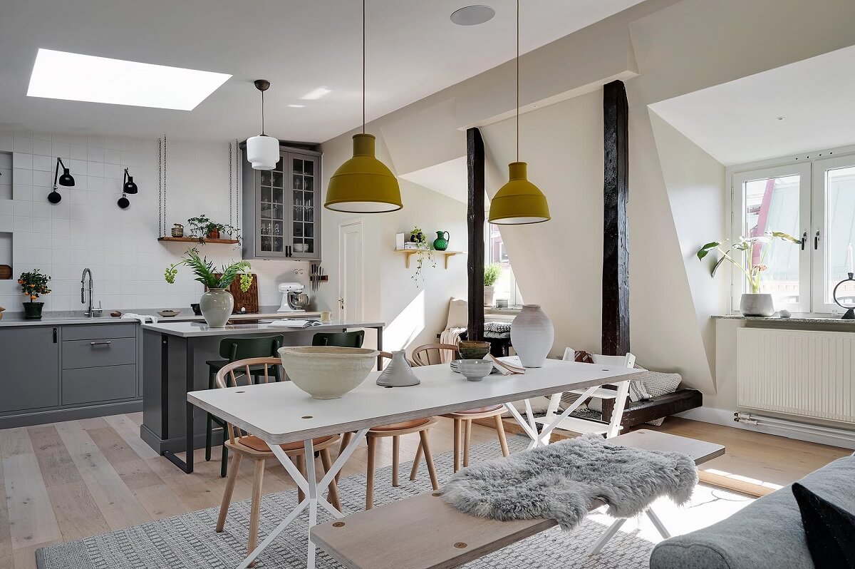 A Modern Scandinavian Attic Apartment 5 white-dining-table-yellow-industrial-pendants-nordroom