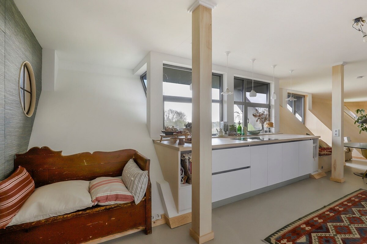 A Unique Upside Down House in The Netherlands 15 white-galley-kitchen-antique-bench-nordroom