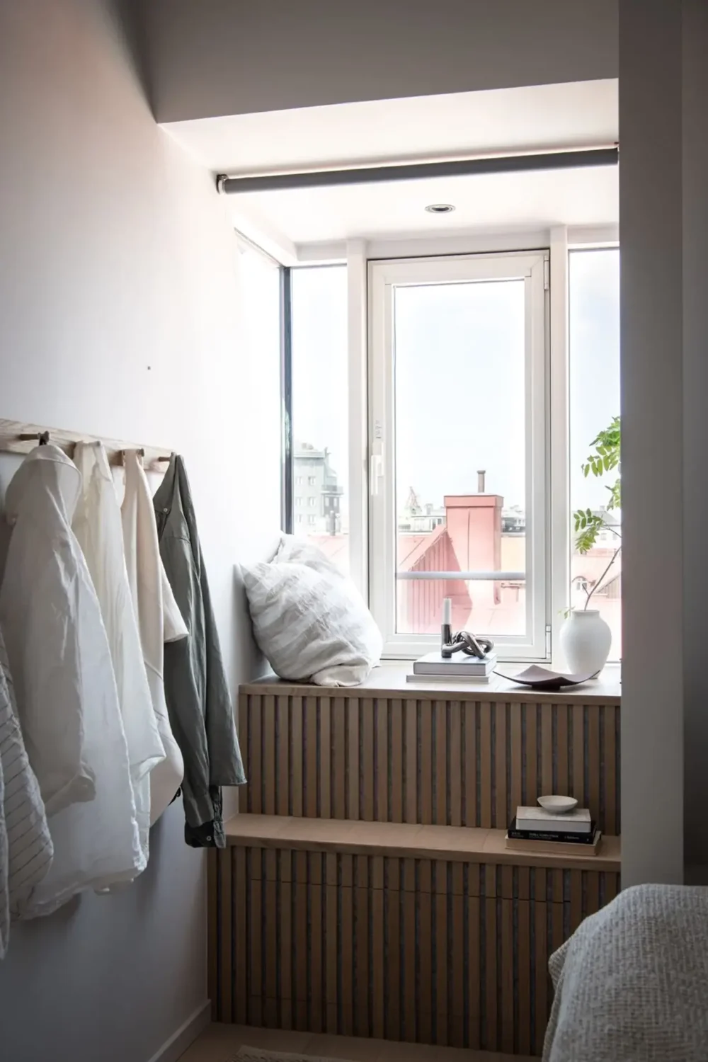 A Stylish Scandinavian Attic Apartment 13 wood-slatted-window-seat-scandinavian-attic-apartment-nordroom