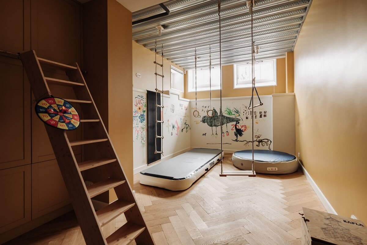 A Grand Renovated Family Home in Amsterdam 27 basement-kids-playroom-built-in-cabinets-nordroom