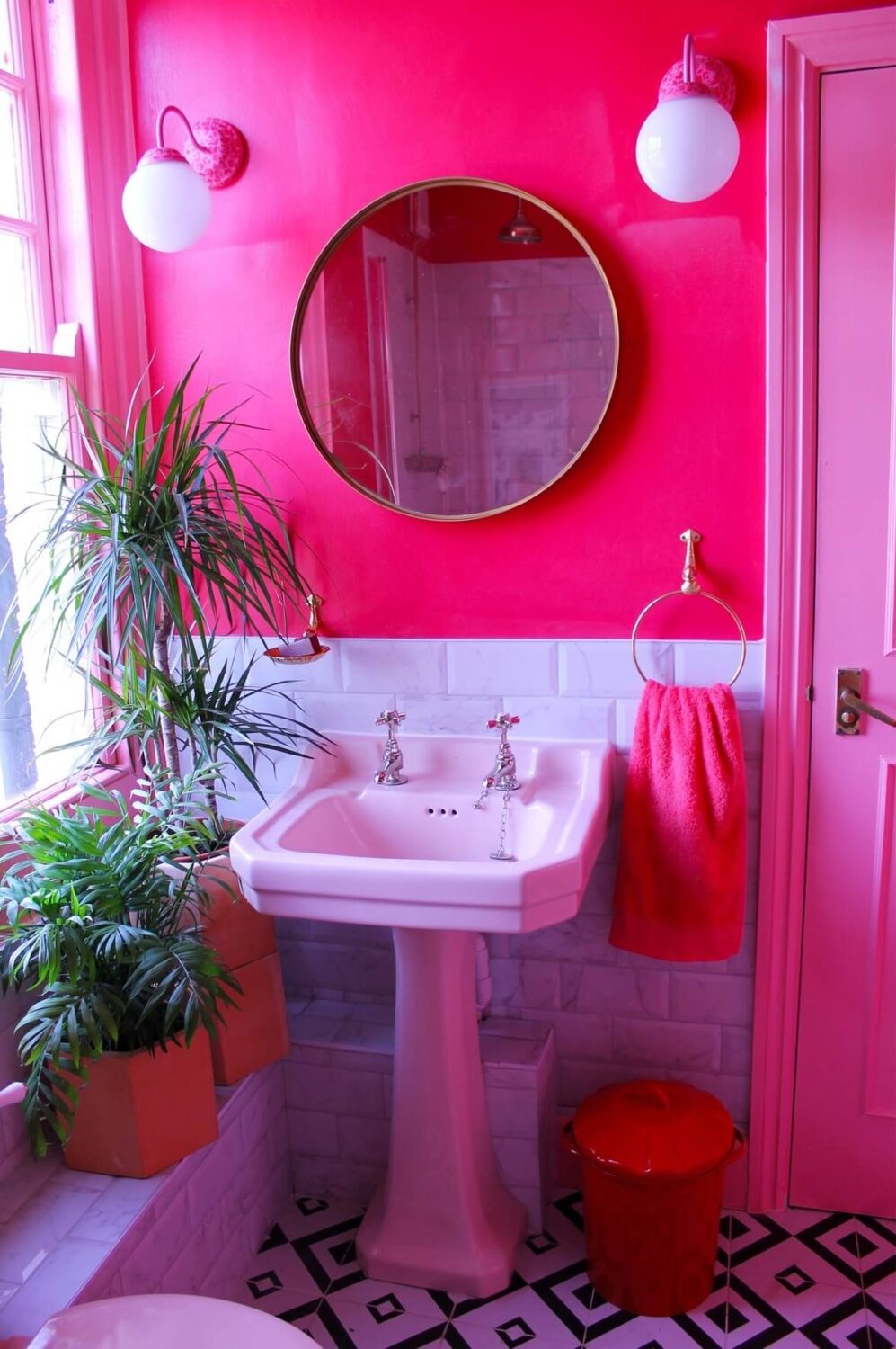 89 Pink Bathroom Ideas: From Hot Pink Walls to Blush Tiles 23 bathroom-hot-pink-walls-round-mirror-nordroom