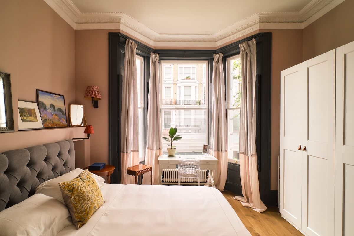 Bold Colors and Light Rooms in a Historic Apartment 12 bedroom-pink-wall-paint-bay-window-nordroom