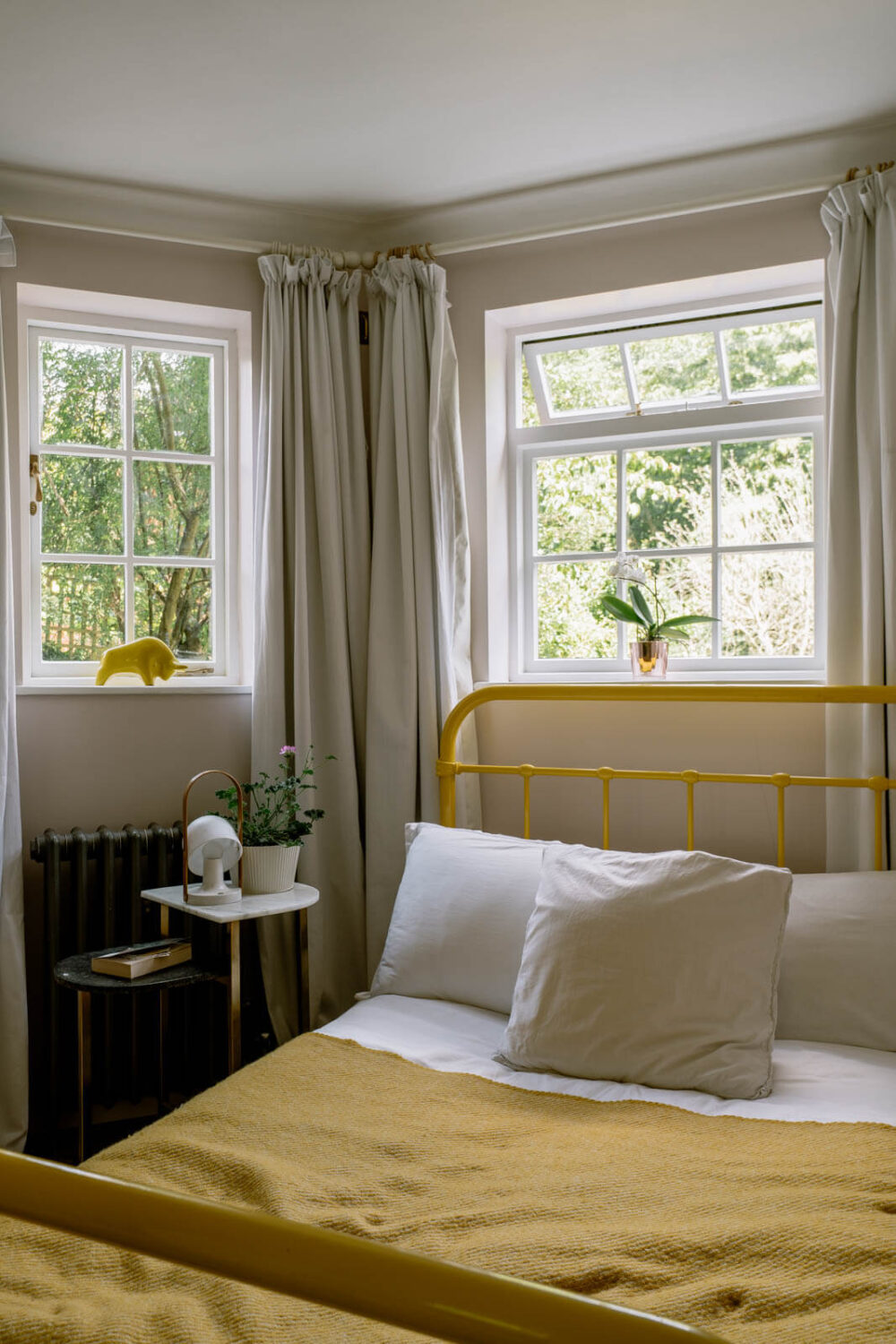 A London Home with Color Accents and a Secret Garden Shed 13 bedroom-yellow-bedframe-london-apartment-nordroom