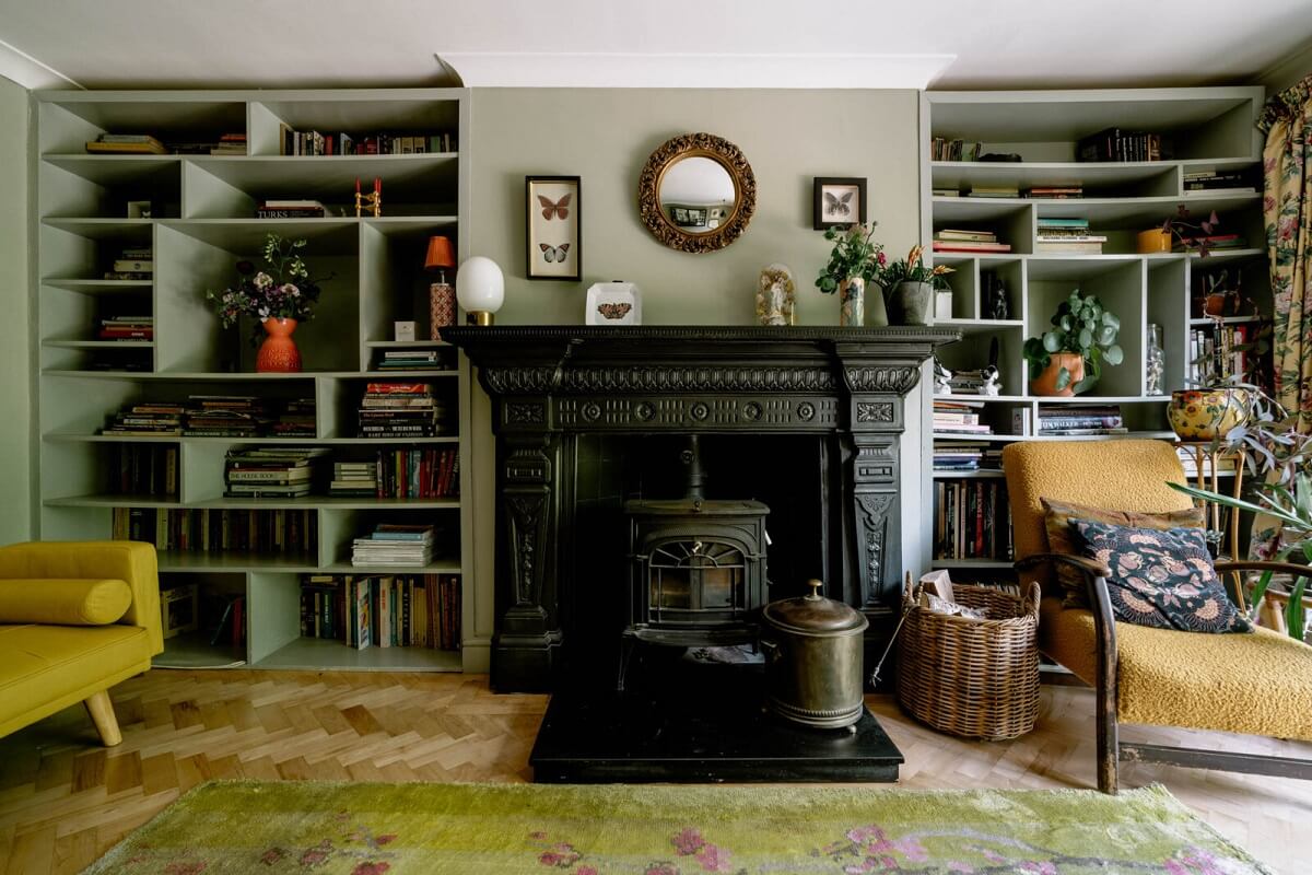A London Home with Color Accents and a Secret Garden Shed 4 black-fireplace-green-living-room-nordroom