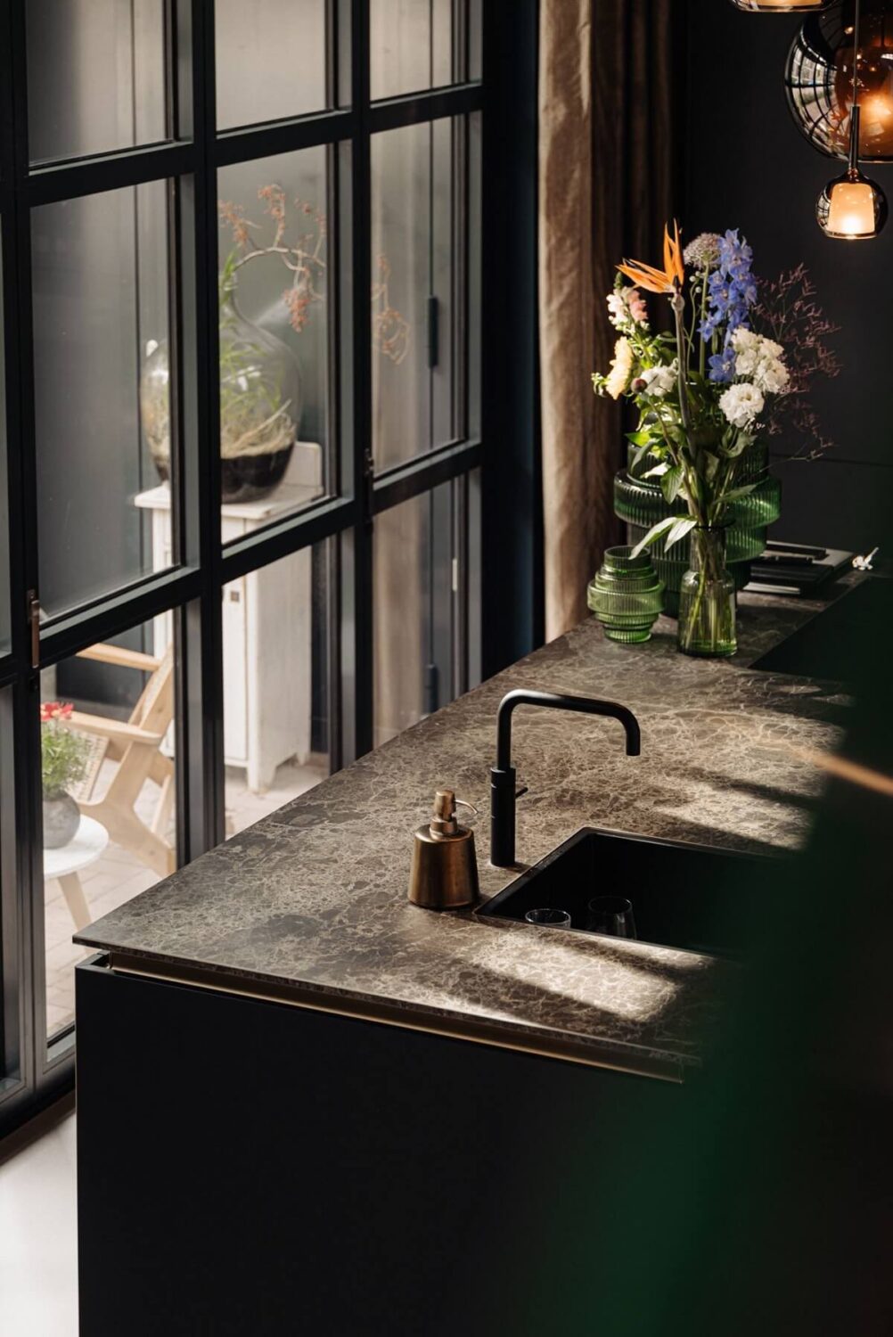 An Industrial Loft Home in Amsterdam 9 black-kitchen-island-industrial-windows-nordroom
