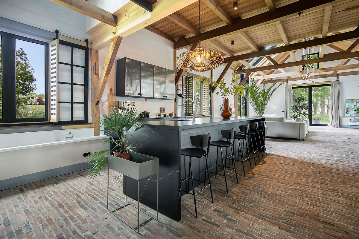 A Dutch Barn House with Brick Floors and Wooden Ceilings 12 black-marble-kitchen-island-breakfast-bar-nordroom
