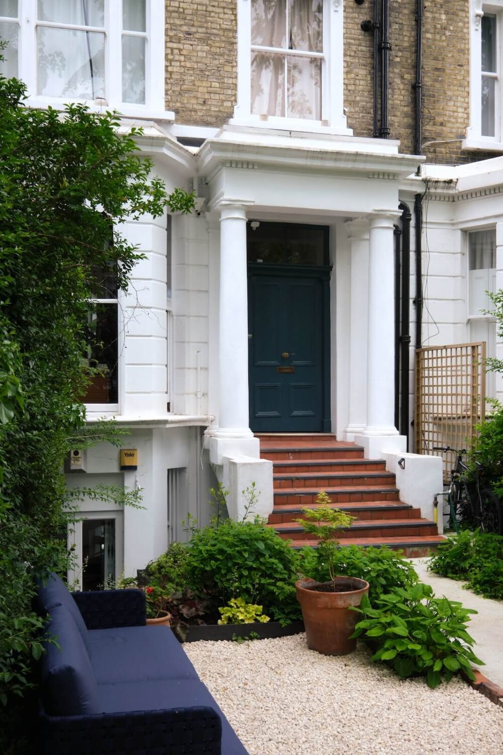 Bold Colors and Light Rooms in a Historic Apartment 17 blue-front-door-early-victorian-townhouse-garden-seating-nordroom