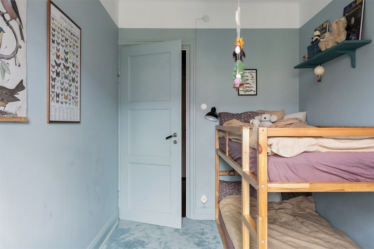 A Warm Scandinavian Apartment Filled with Books & Plants 16 bunk-beds-small-kids-bedroom-blue-walls-nordroom