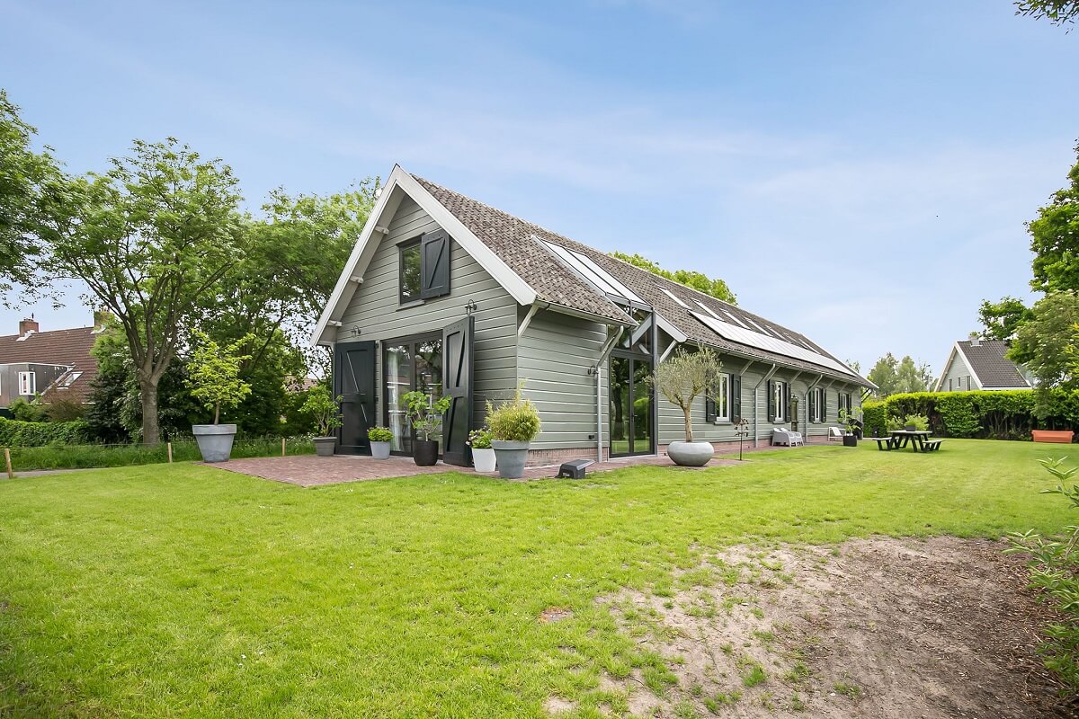 A Dutch Barn House with Brick Floors and Wooden Ceilings 22 exterior-garden-lake-house-netherlands-nordroom