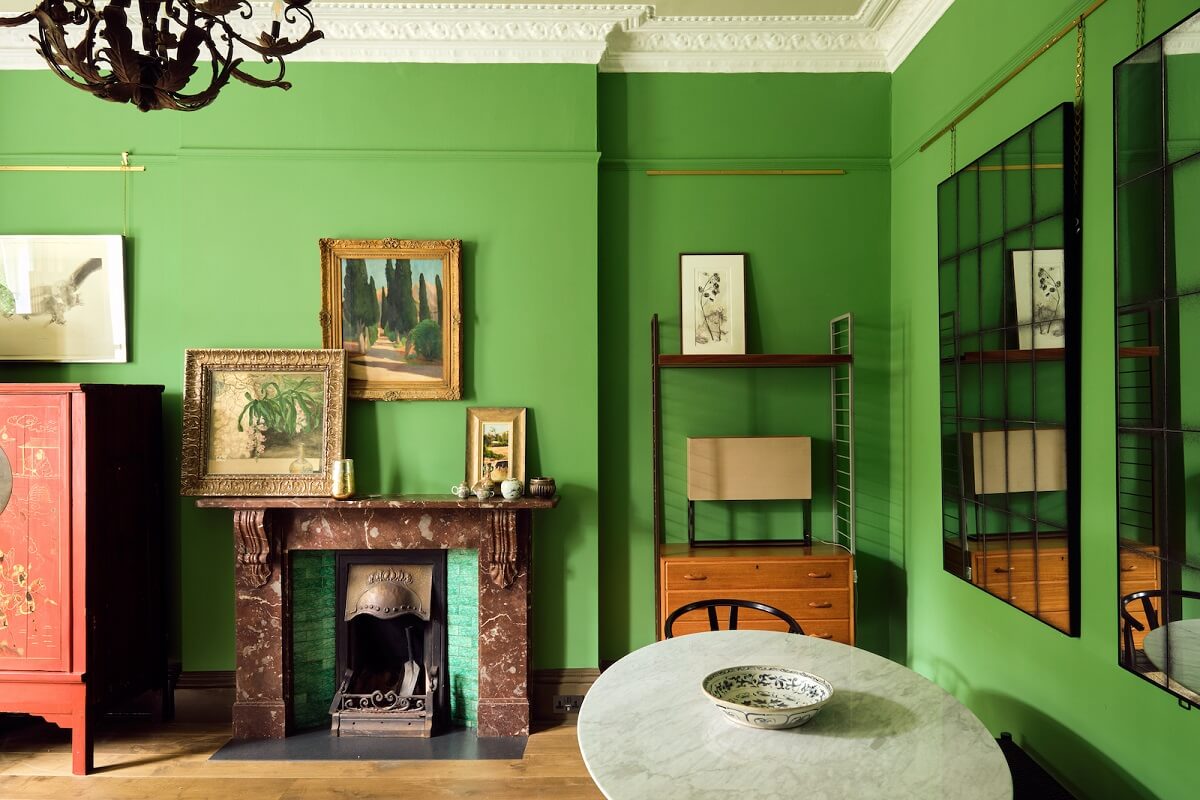 Bold Colors and Light Rooms in a Historic Apartment 5 farrow-ball-emerald-green-walls-living-room-fireplace-nordroom