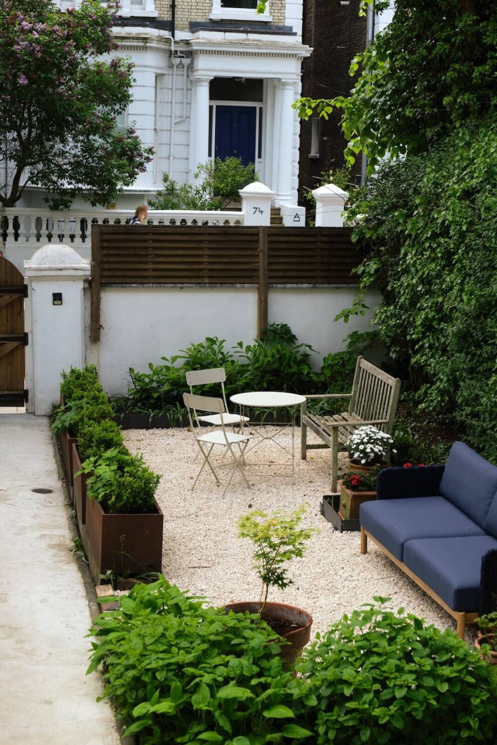Bold Colors and Light Rooms in a Historic Apartment 16 front-garden-with-dining-area-and-lounge-sofa-nordroom