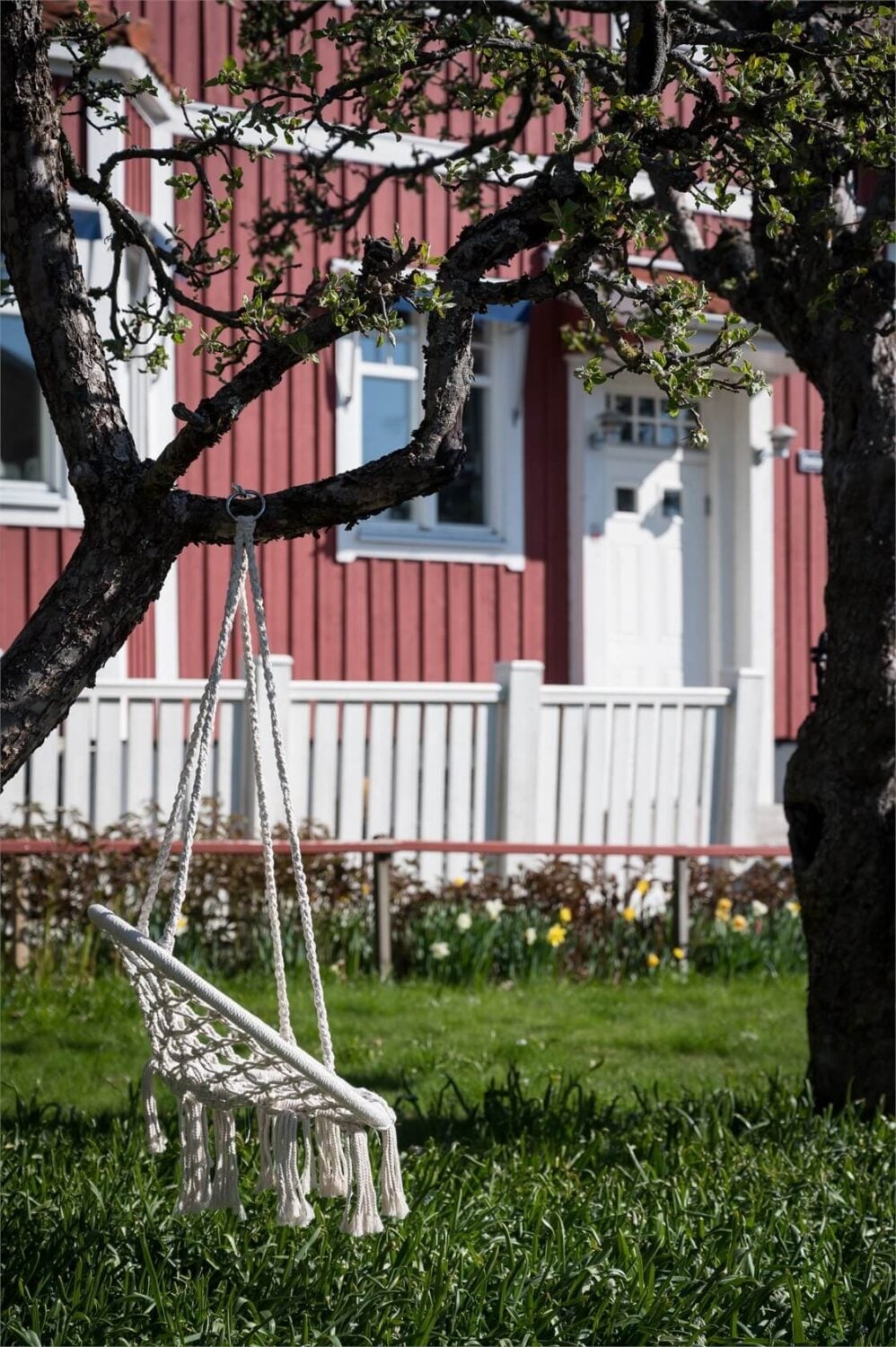 Natural Light in a Family Home in Sweden 20 garden-hanging-chair-swedish-home-nordroom