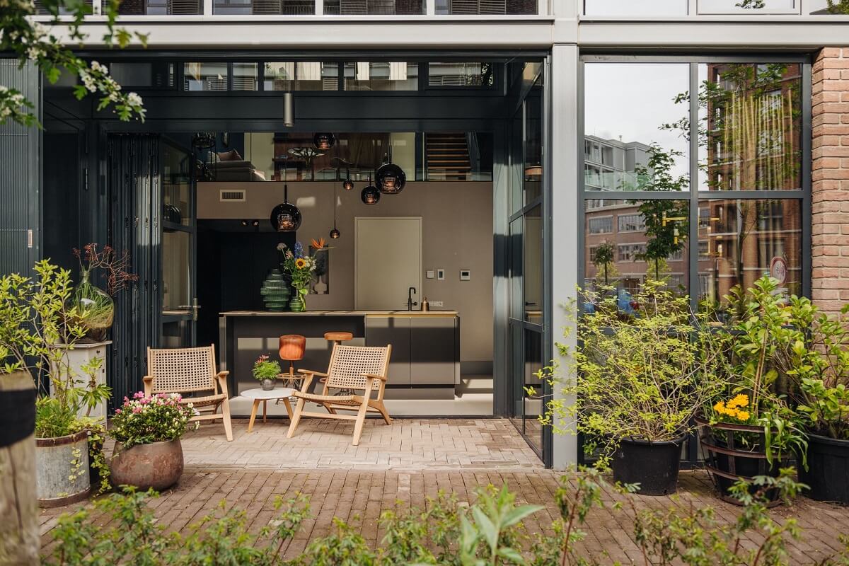 An Industrial Loft Home in Amsterdam 14 garden-outdoor-seating-sliding-doors-nordroom