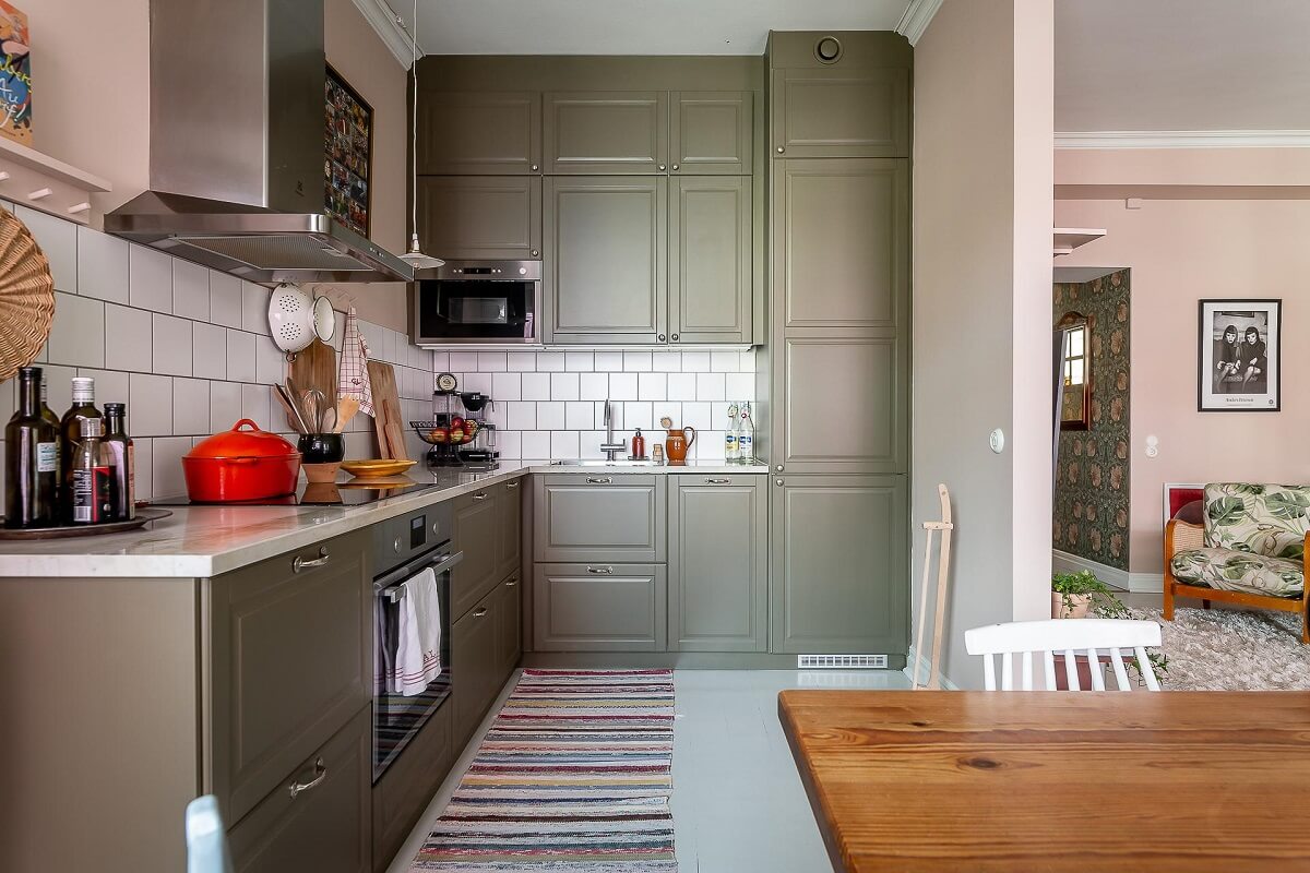 A Bright Swedish Apartment with William Morris Wallpaper 10 gray-green-ikea-kitchen-marble-countertop-nordroom