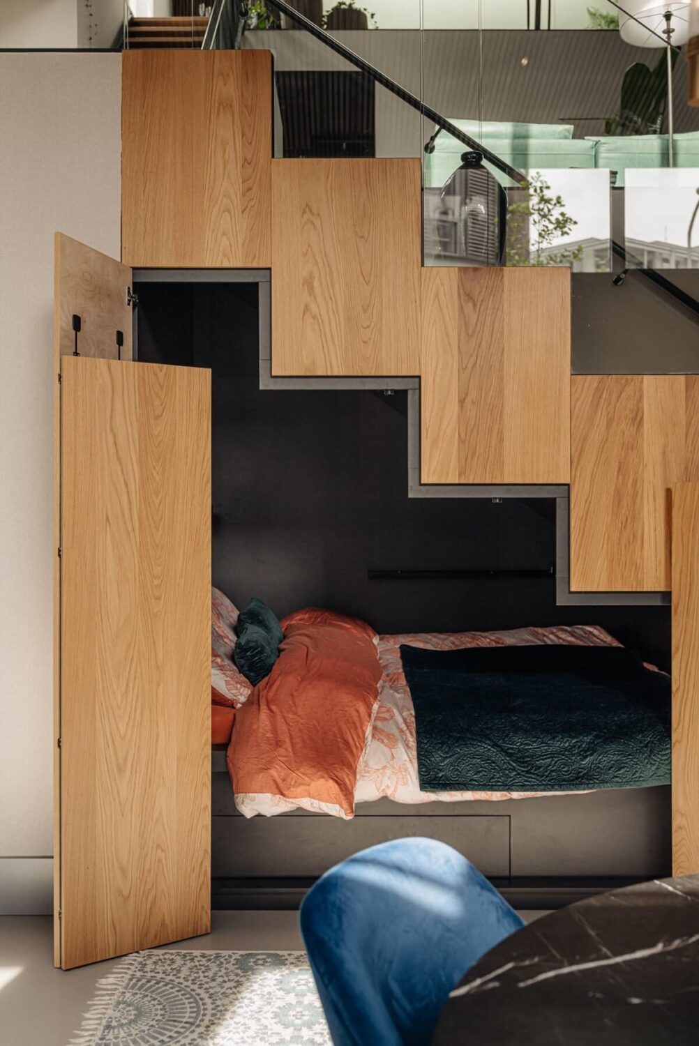 An Industrial Loft Home in Amsterdam 10 guest-bed-under-the-stairs-loft-nordroom