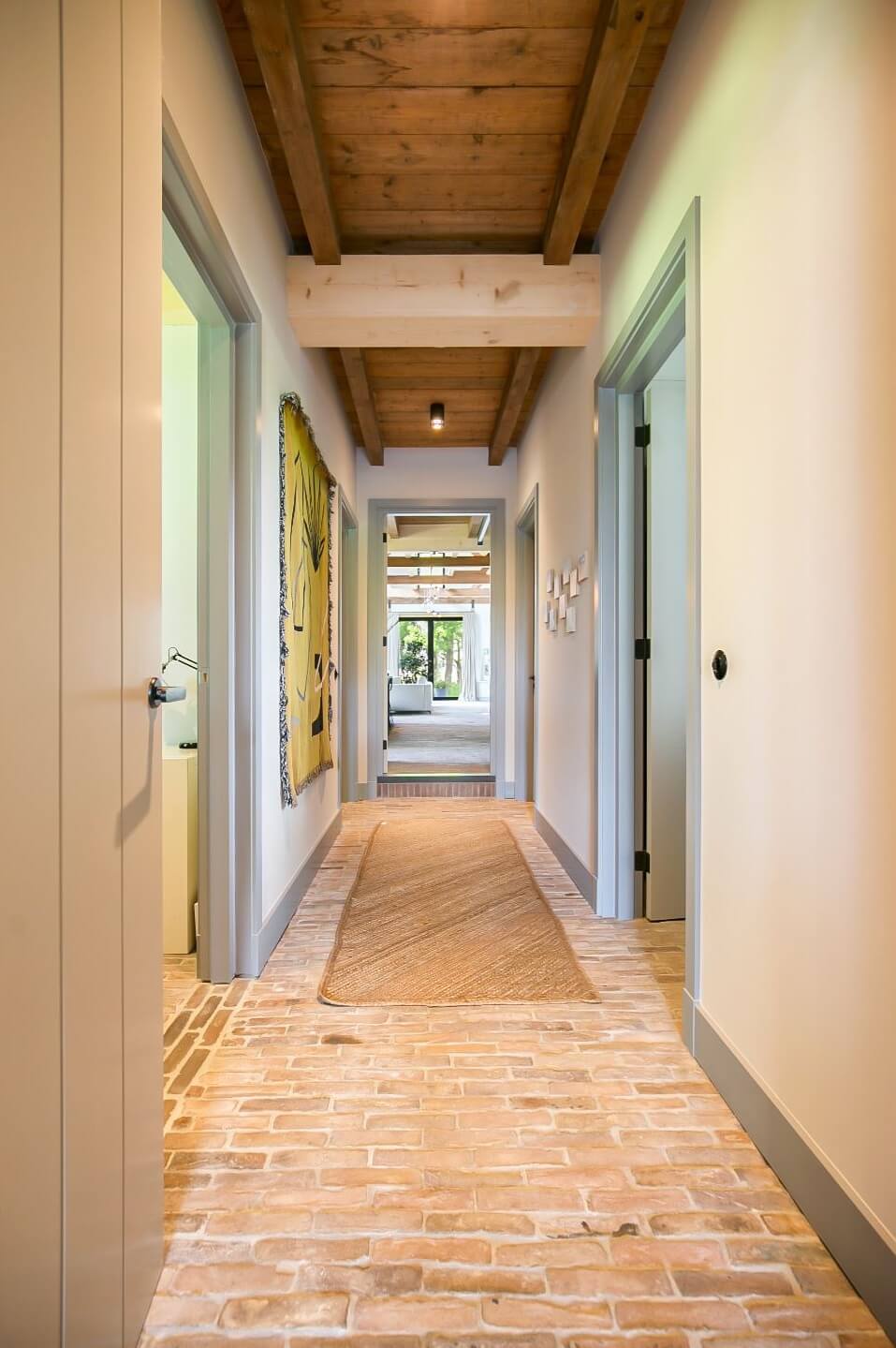 A Dutch Barn House with Brick Floors and Wooden Ceilings 14 hallway-brick-floor-wooden-ceiling-nordroom
