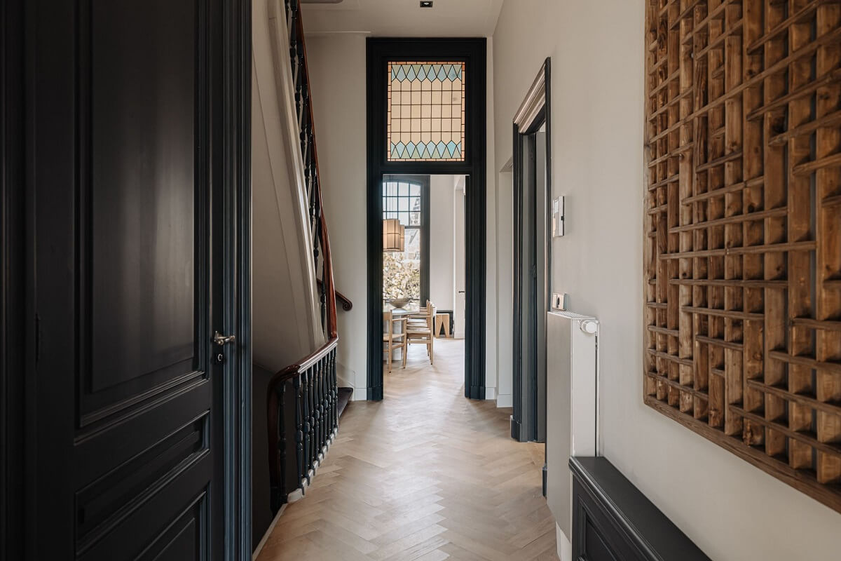 A Monochrome Duplex Apartment in Amsterdam 12 hallway-dark-gray-painted-doors-nordroom
