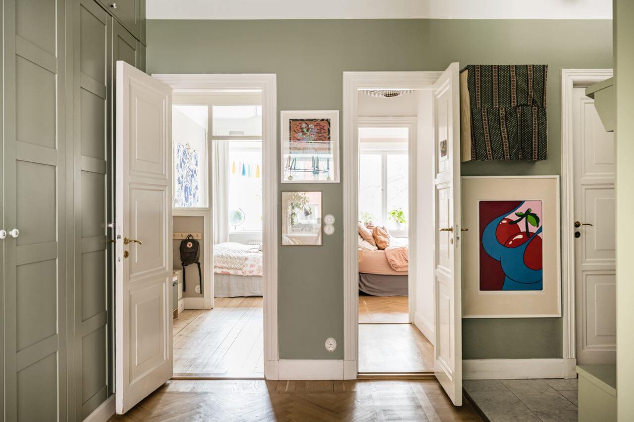 Green Color Accents in a Beautiful Historic Apartment 26 hallway-floor-to-ceiling-built-in-closets-green-walls-nordroom