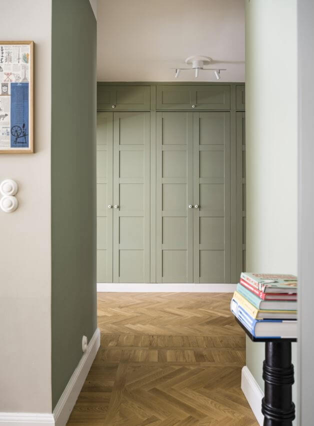 Green Color Accents in a Beautiful Historic Apartment 24 hallway-wooden-floor-built-in-green-closets-nordroom