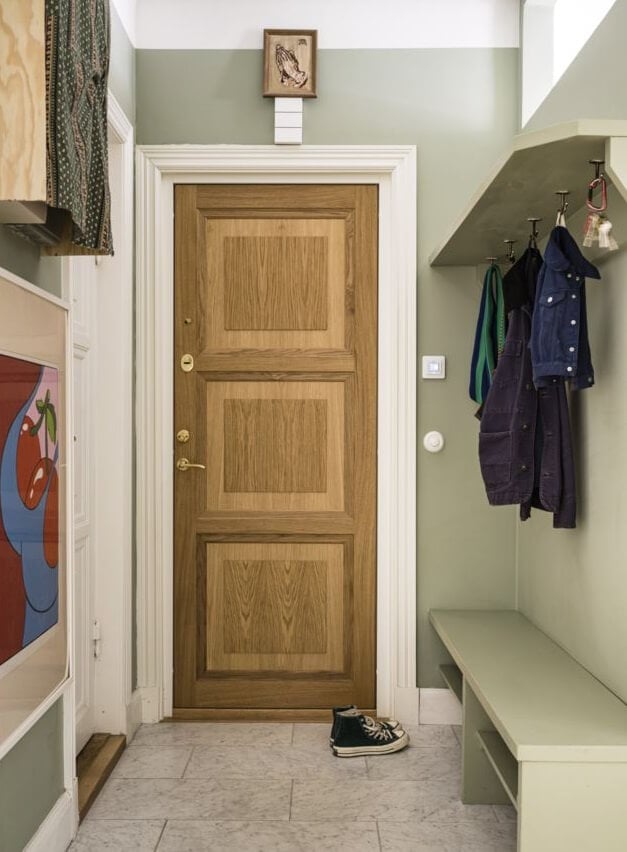 Green Color Accents in a Beautiful Historic Apartment 25 hallway-wooden-front-door-bench-nordroom