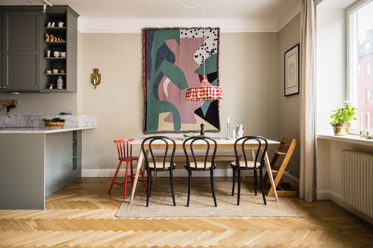 Green Color Accents in a Beautiful Historic Apartment 7 kitchen-dining-table-large-artwork-wooden-floor-nordroom