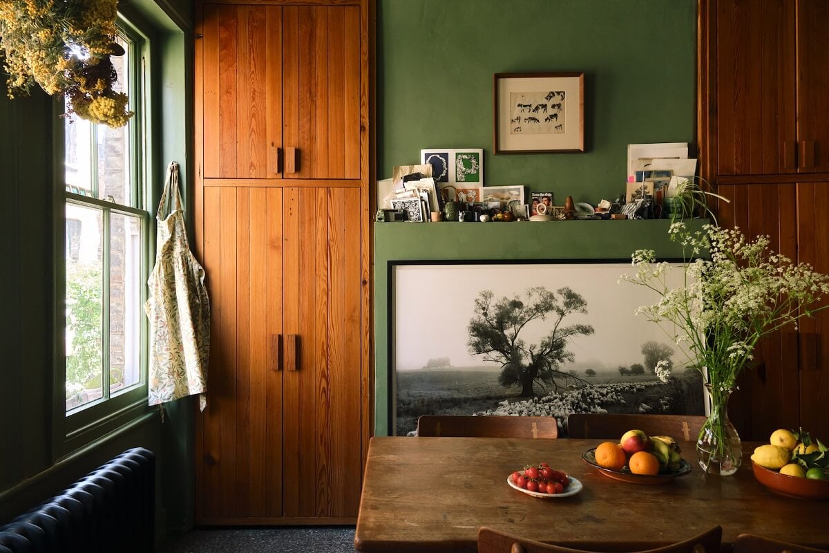 Bold Colors and Historic Details in a Victorian Apartment 11 kitchen-green-walls-built-in-wooden-cabinets-nordroom