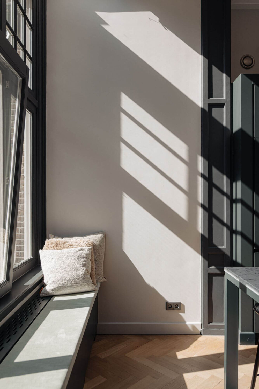 A Monochrome Duplex Apartment in Amsterdam 11 kitchen-window-seat-natural-light-nordroom