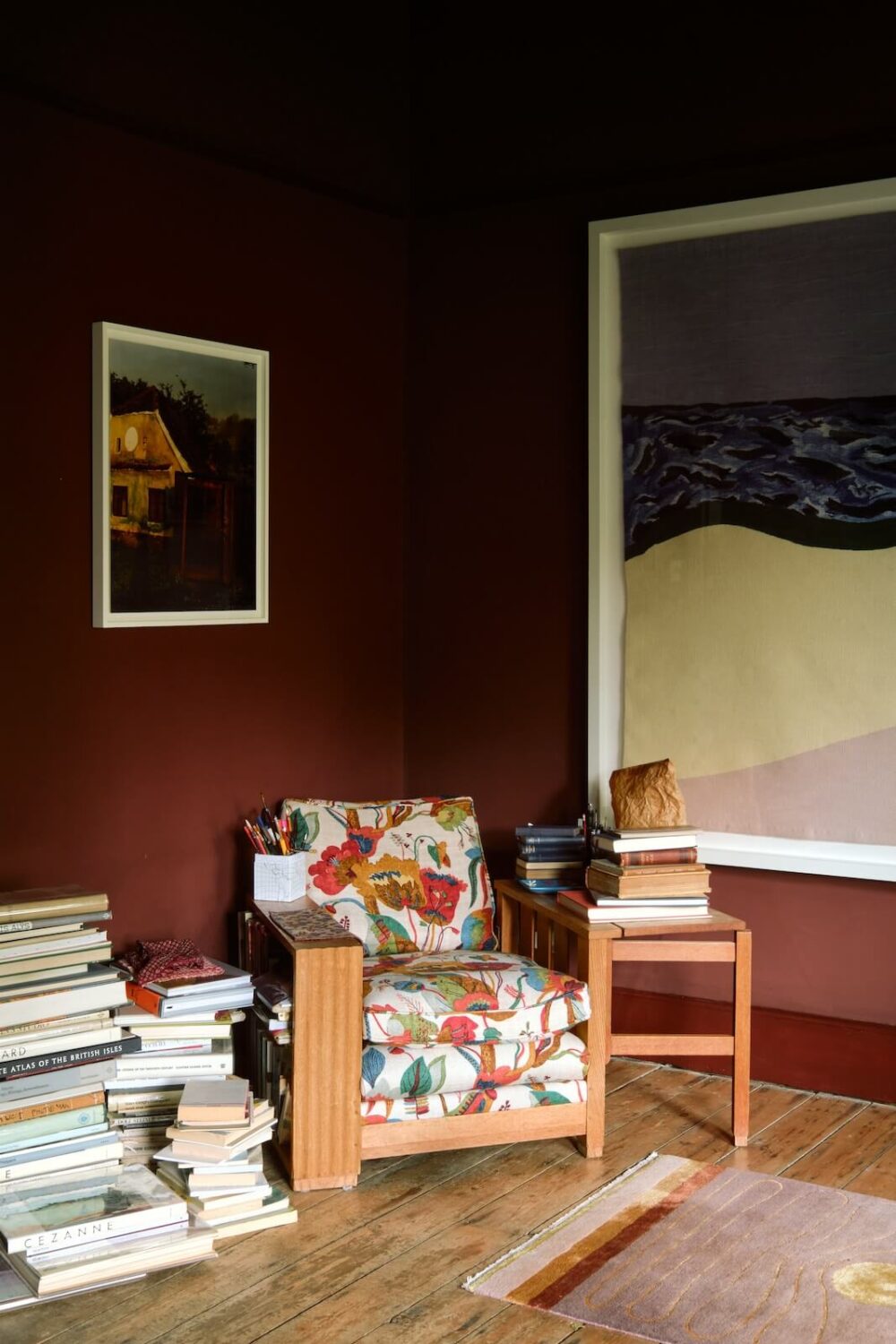 Bold Colors and Historic Details in a Victorian Apartment 5 living-room-deep-red-walls-large-artwork-nordroom
