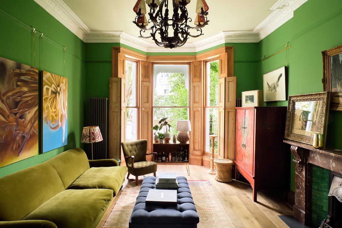 Bold Colors and Light Rooms in a Historic Apartment 1 living-room-emerald-green-walls-bay-window-wood-shutters-nordroom