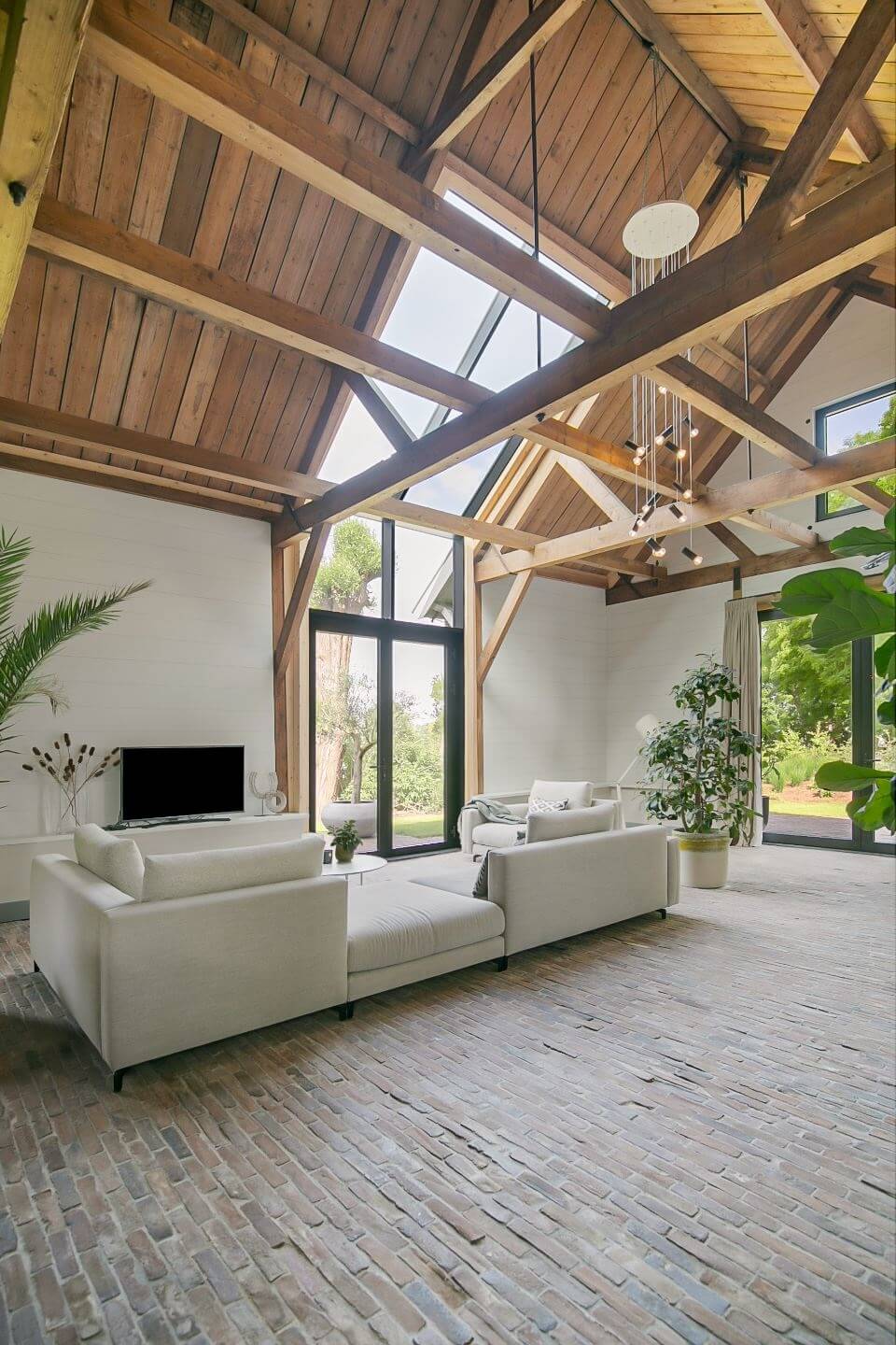 A Dutch Barn House with Brick Floors and Wooden Ceilings 2 living-room-high-wooden-ceiling-brick-floor-nordroom