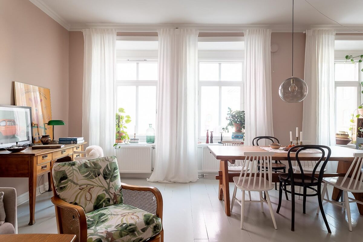 A Bright Swedish Apartment with William Morris Wallpaper 4 living-room-pink-walls-white-painted-floorboards-nordroom