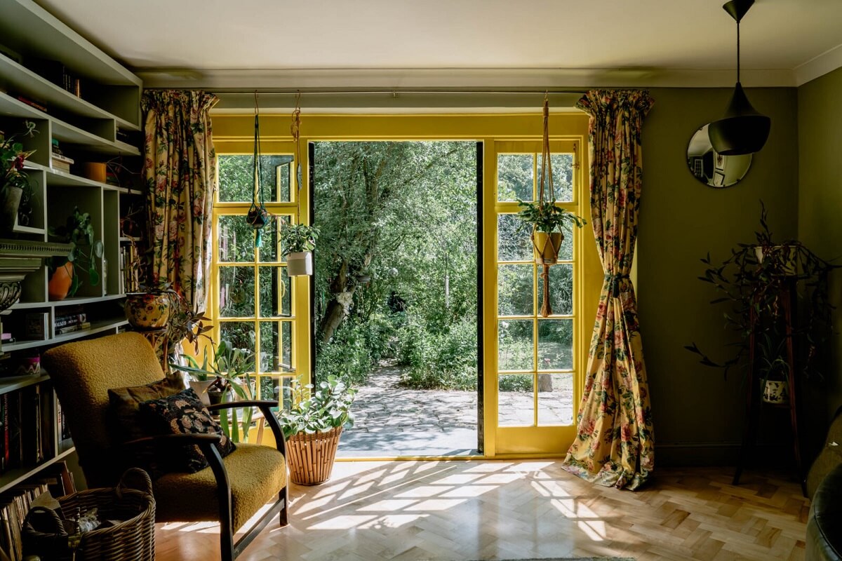 A London Home with Color Accents and a Secret Garden Shed 1 living-room-sage-green-walls-yellow-trimmings-bookshelves-nordroom