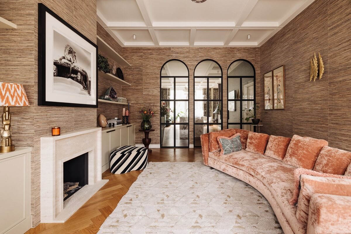 A Grand Renovated Family Home in Amsterdam 6 living-room-wallpaper-fireplace-curved-pink-couch-nordroom